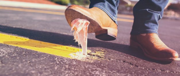 Man stepping on chewing gum